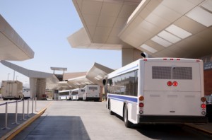 Airport shuttle bus parked outside an airport waiting for passengers